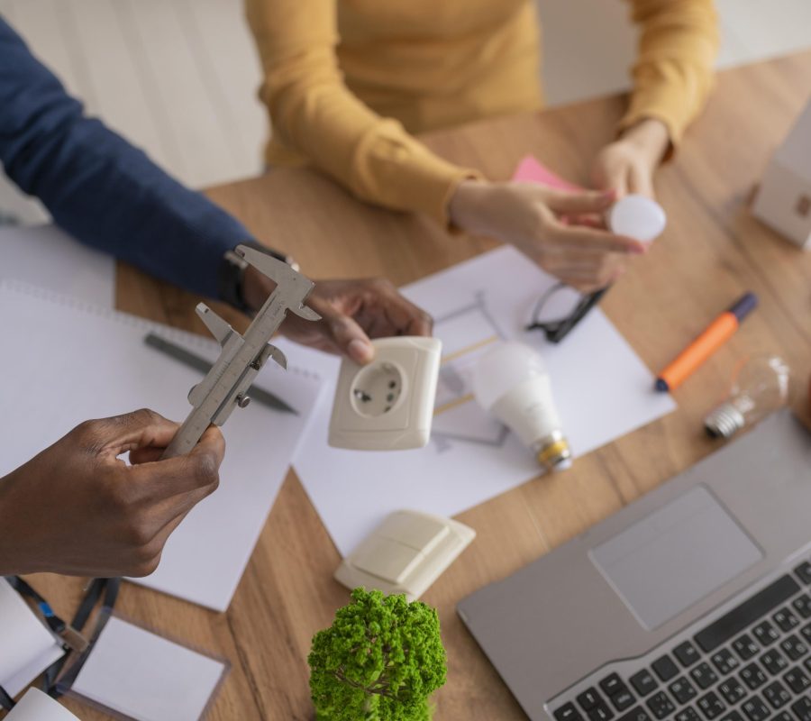 colleagues-working-together-environment-project-close-up