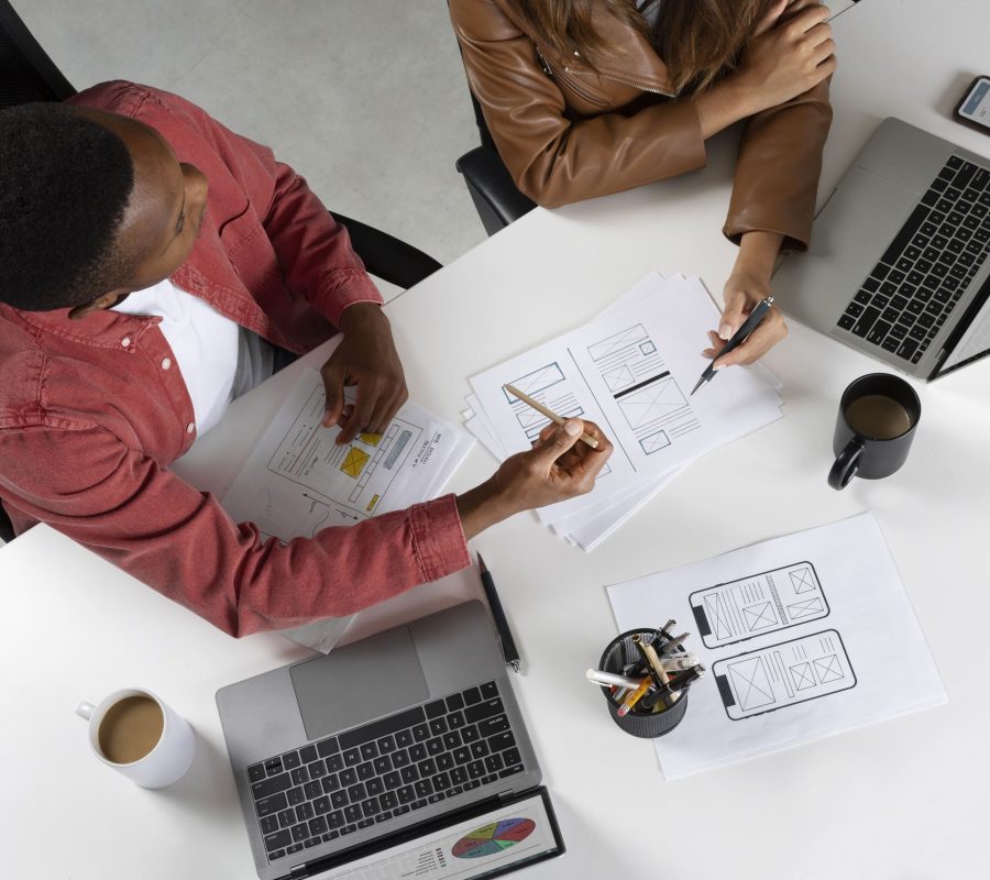 top-view-people-working-with-laptops (1)